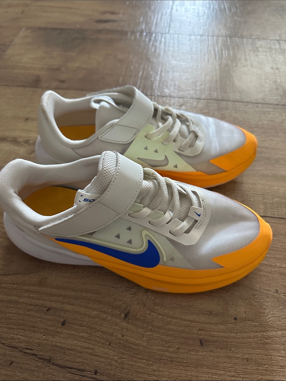 Nike Kids White and Orange Sneakers with Blue Swoosh